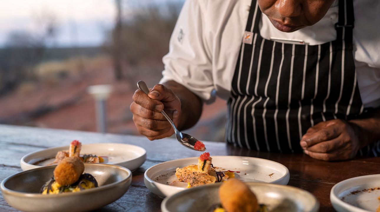 Tali Wiru chef preparing entrees