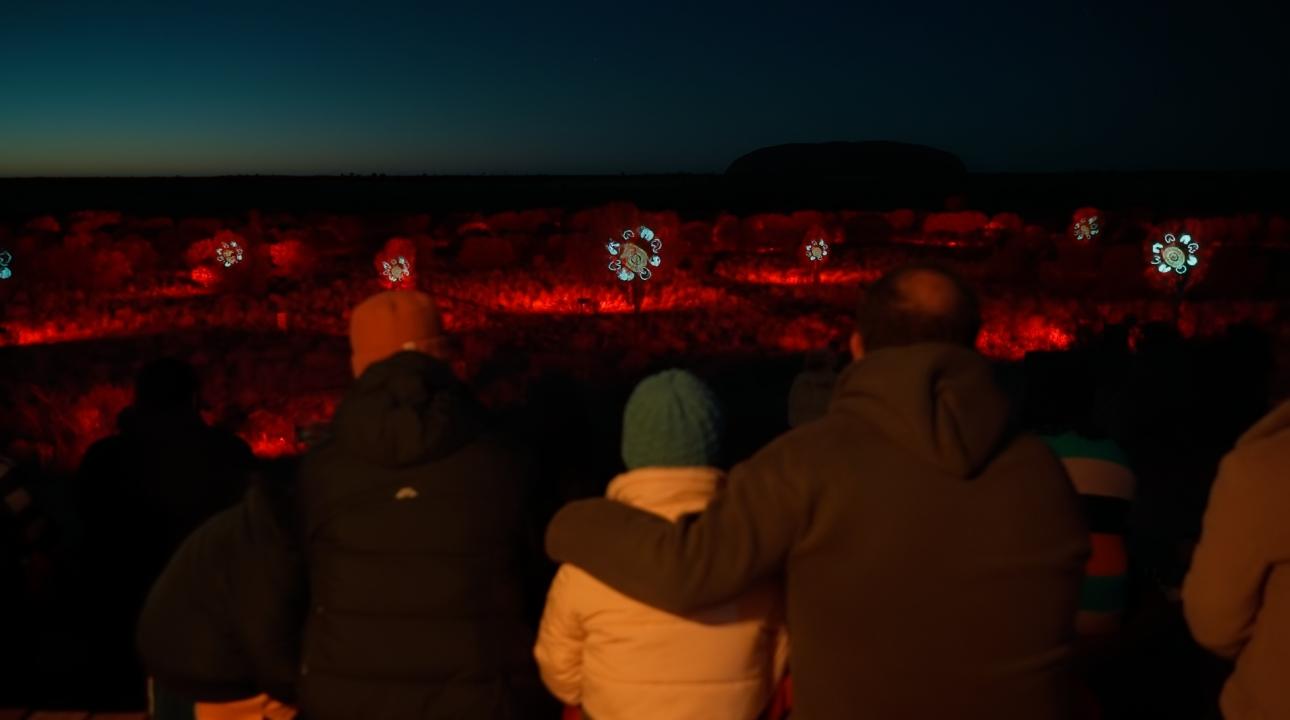 Family watching the sunrise journey 