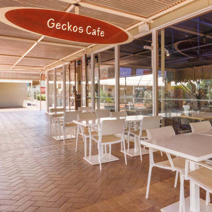 White Table and chairs outside of Geckos Cafe located in Towns Square at Ayers Rock Resort