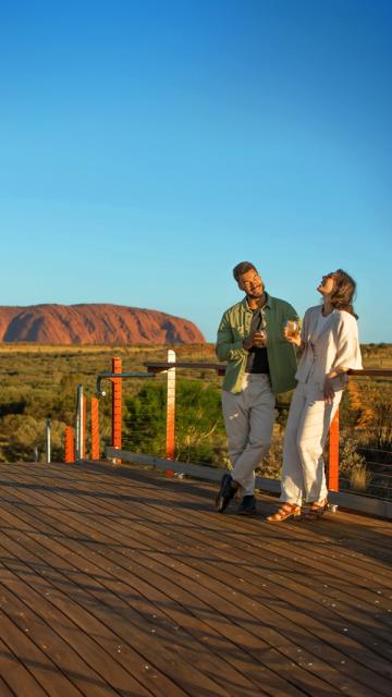 Couple in front of Uluru laughing